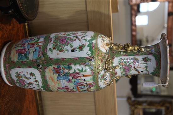 A large Chinese Canton-decorated famille rose baluster vase, 19th century, height 63cm, wood stand